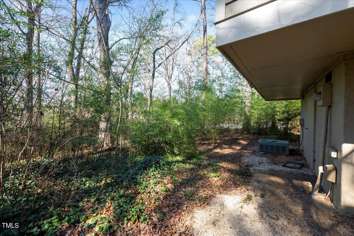 3501 Mill Run Raleigh, NC 27612 - Photo 24 of 24 a backyard of a house with lots of green space