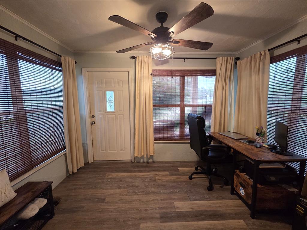 124 East F Street Frostproof, FL 33843 - Photo 5 of 37 a view of a workspace with furniture and a window