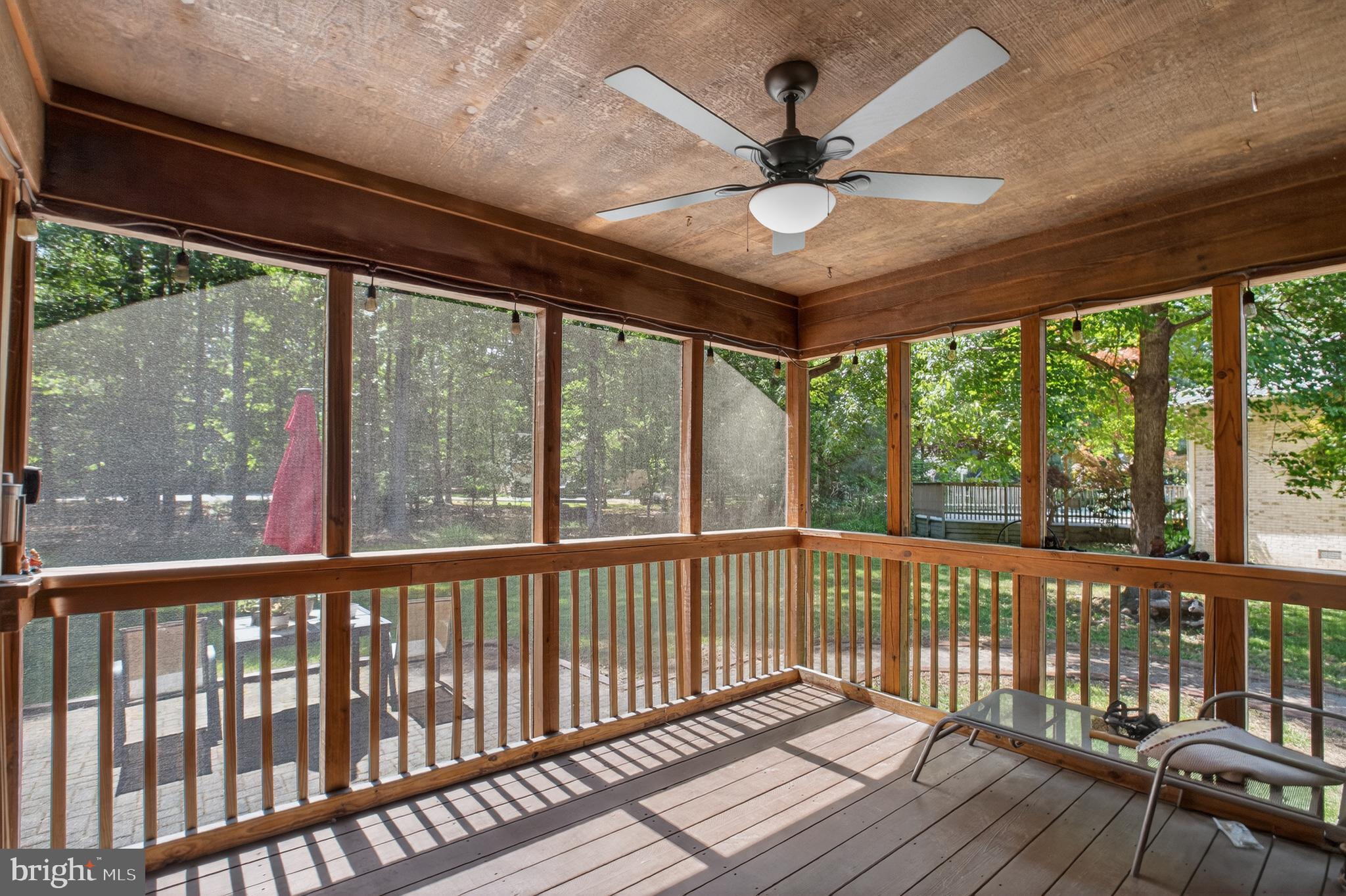 14575 Honeysuckle Way Issue, MD 20645 - Photo 14 of 49 a view of a balcony with a ceiling fan and a large window