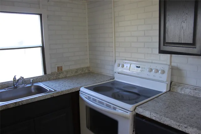a bathroom with a sink and toilet