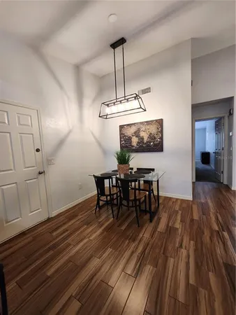 a kitchen with stainless steel appliances granite countertop a refrigerator and a stove