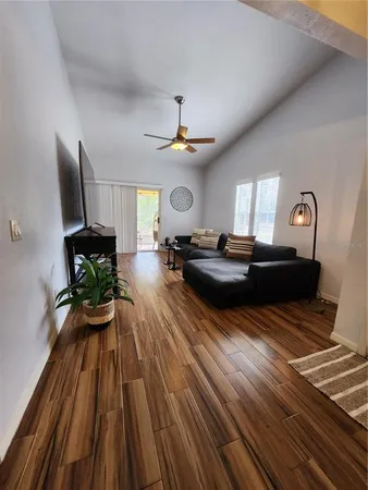 a living room with furniture and a large window