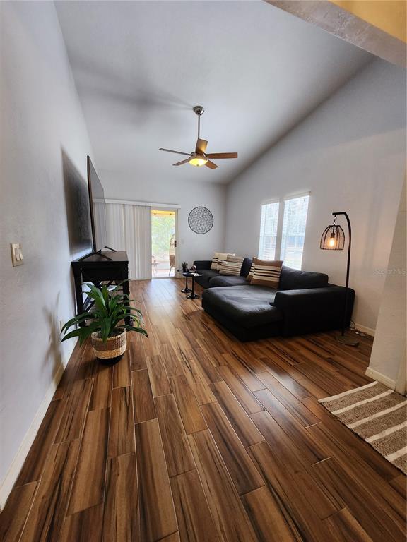 4801 Northwest 2nd Place Gainesville, FL 32607 - Photo 20 of 36 a living room with furniture and a fireplace