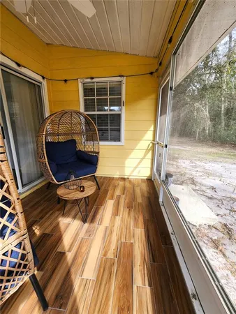 a view of kitchen with wooden floor and window