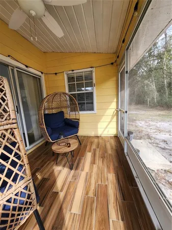 a view of kitchen with sink and refrigerator