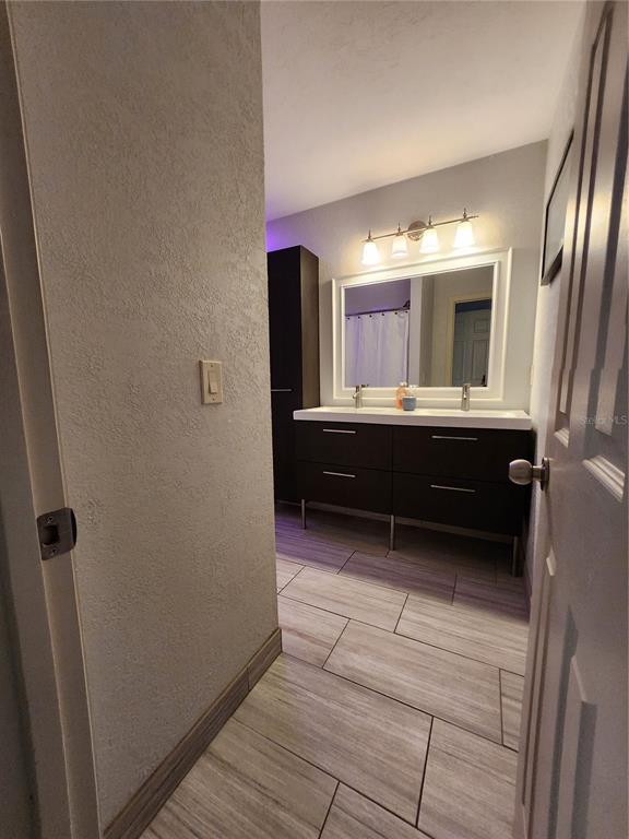 4801 Northwest 2nd Place Gainesville, FL 32607 - Photo 27 of 36 a view of kitchen with sink and refrigerator