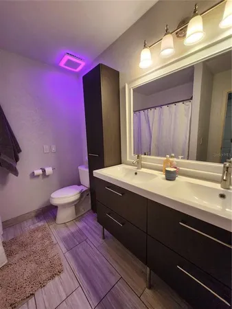 a room with red walls and a potted plant