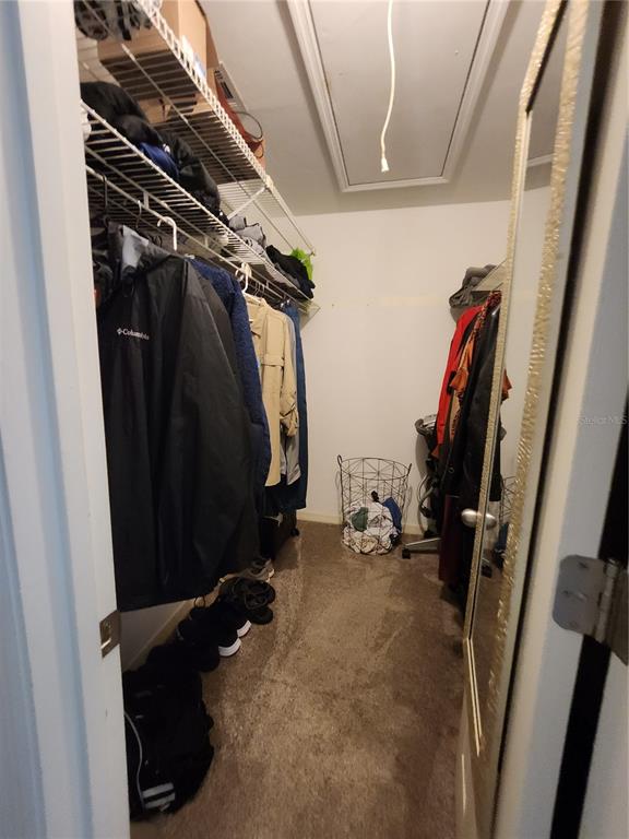 4801 Northwest 2nd Place Gainesville, FL 32607 - Photo 31 of 36 a view of walk in closet with clothes and shoes