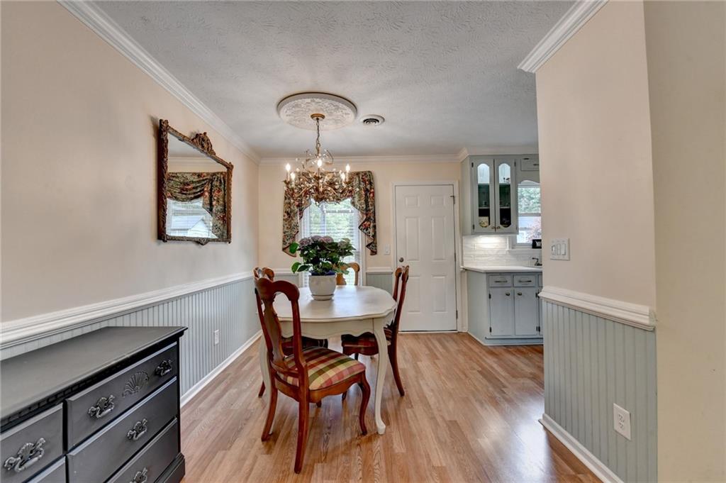 501 Wages Road Auburn, GA 30011 - Photo 12 of 50 a view of a dining room with furniture and wooden floor