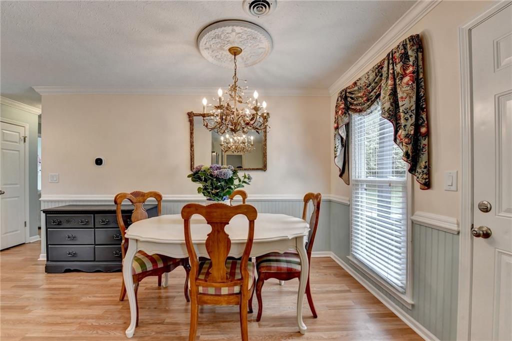 501 Wages Road Auburn, GA 30011 - Photo 13 of 50 a view of a dining room with furniture and wooden floor