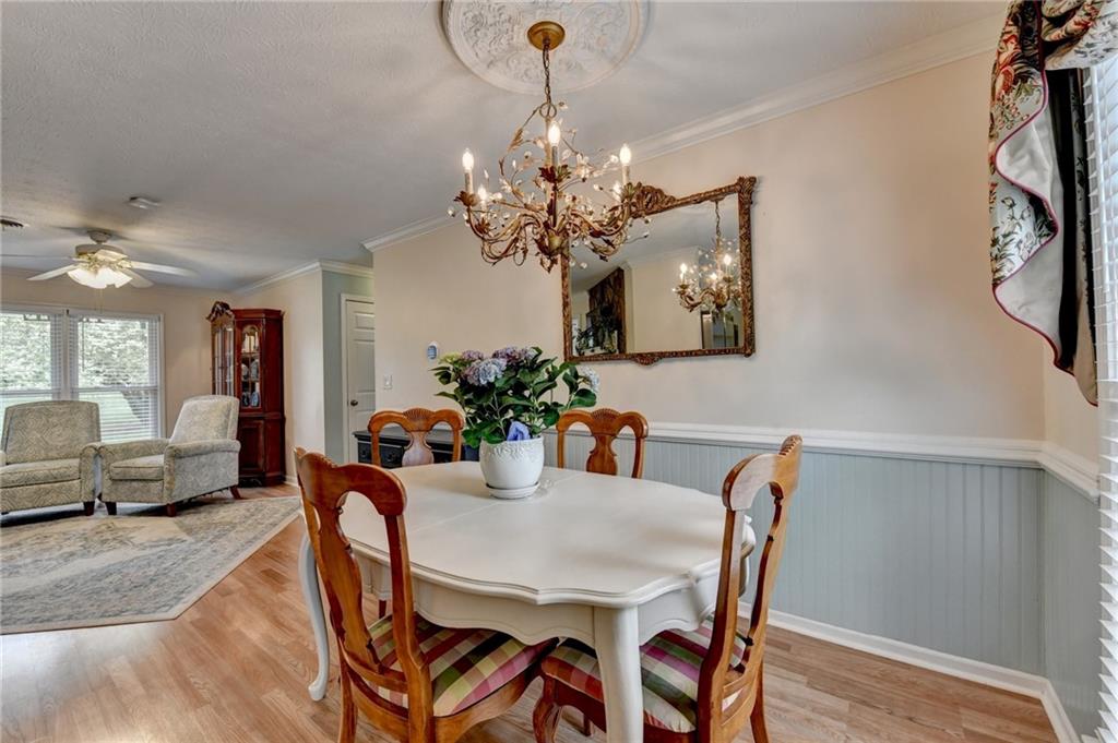 501 Wages Road Auburn, GA 30011 - Photo 14 of 50 a view of a dining room with furniture and wooden floor