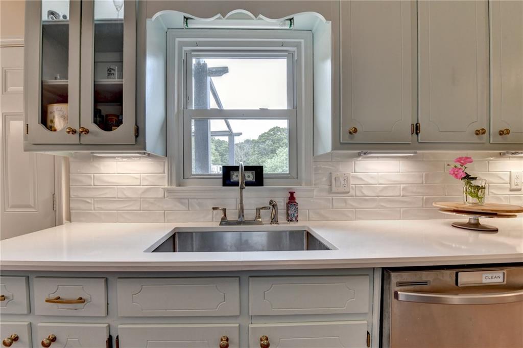501 Wages Road Auburn, GA 30011 - Photo 20 of 50 a kitchen with stainless steel appliances a sink and a window