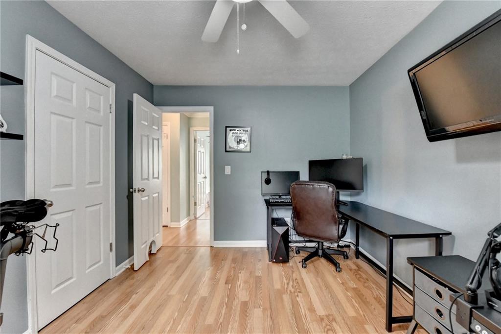 501 Wages Road Auburn, GA 30011 - Photo 23 of 50 a view of a workspace with furniture and a window