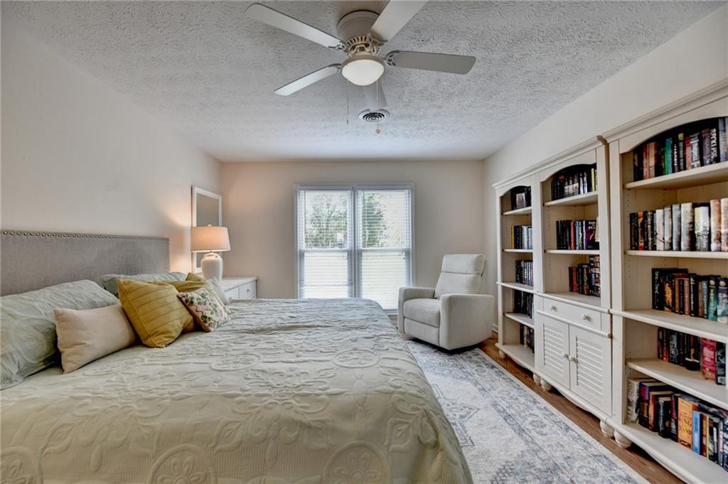 501 Wages Road Auburn, GA 30011 - Photo 28 of 50 a bedroom with bed book shelf and a window