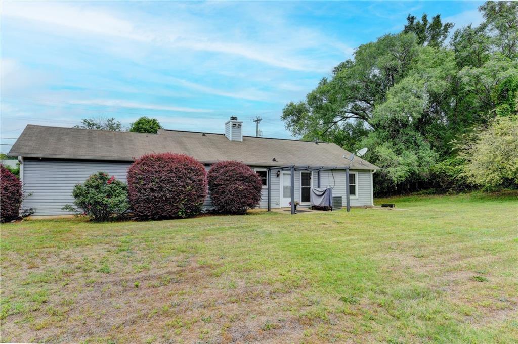 501 Wages Road Auburn, GA 30011 - Photo 48 of 50 a view of a house with a yard and potted plants