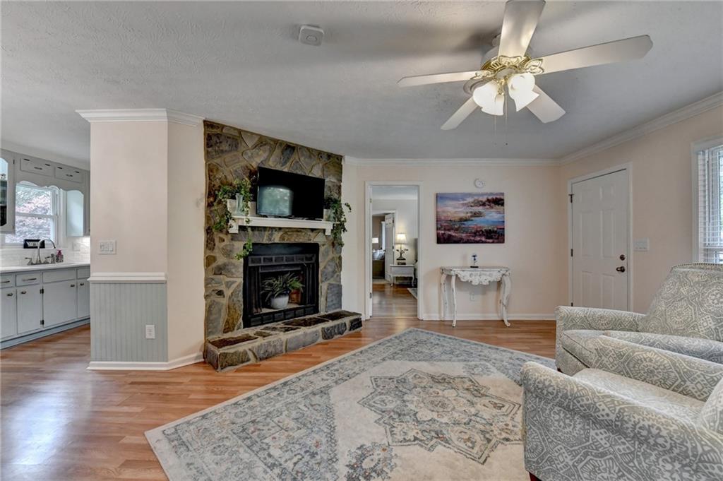501 Wages Road Auburn, GA 30011 - Photo 8 of 50 a living room with furniture a flat screen tv and a fireplace