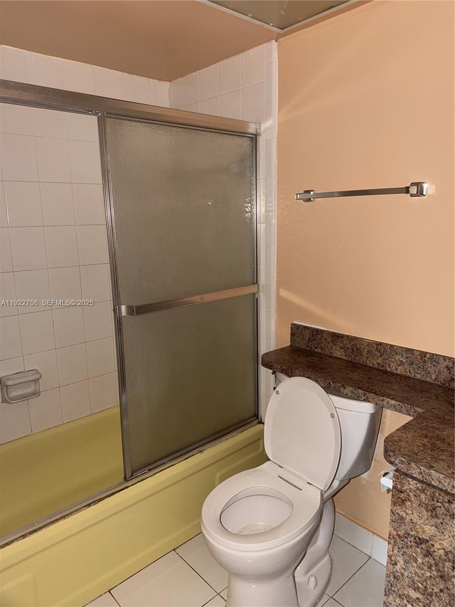 4042 Northwest 19th Street, Unit 305 Lauderhill, FL 33313 - Photo 6 of 8 a bathroom with a toilet and a shower
