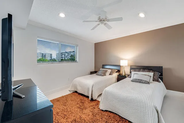 a kitchen with refrigerator and cabinets