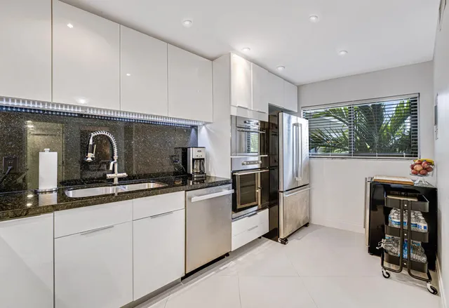 a bedroom with a bed and lamp