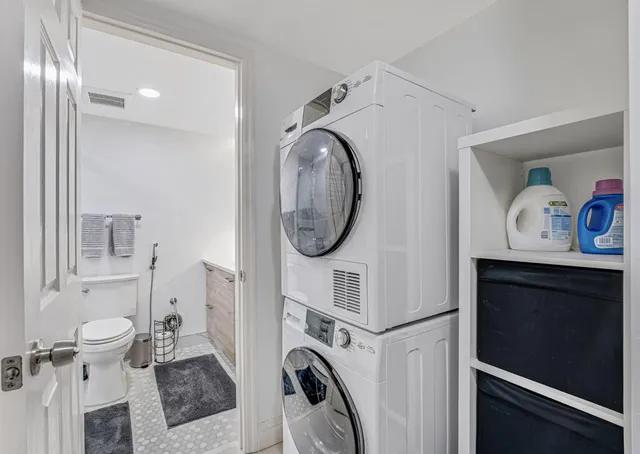 a bathroom with a sink toilet a mirror and shower
