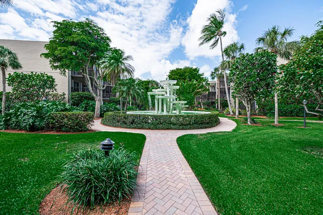 a swimming pool with outdoor seating and yard