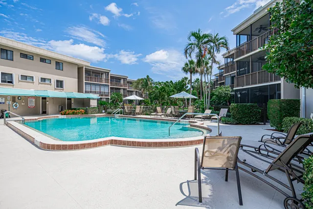 a view of a garden with a building in the background