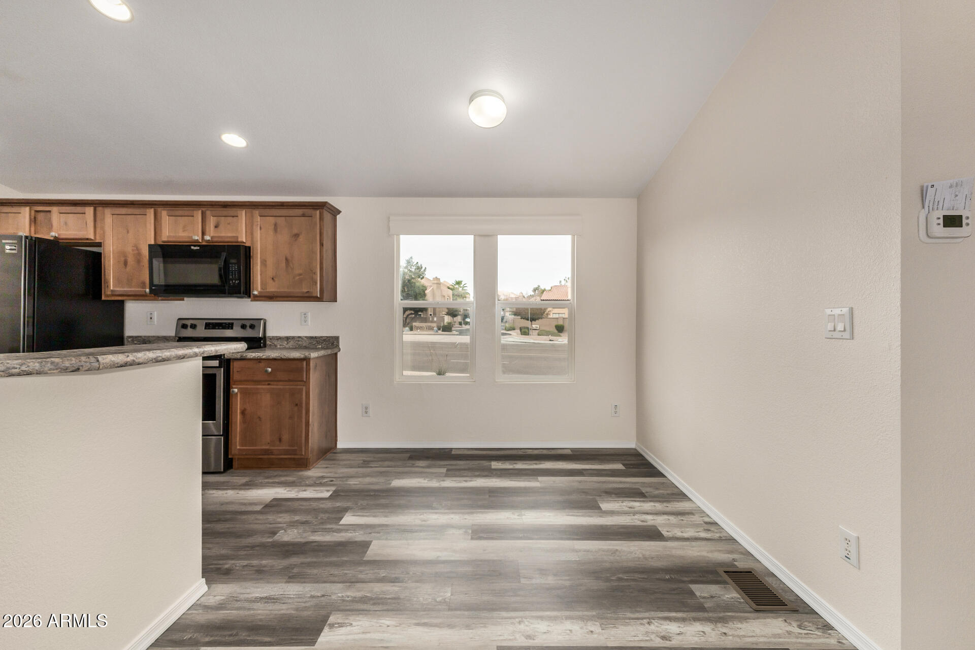 555 West Warner Road, Unit 55 Chandler, AZ 85225 - Photo 12 of 26 a view of kitchen with sink microwave and refrigerator