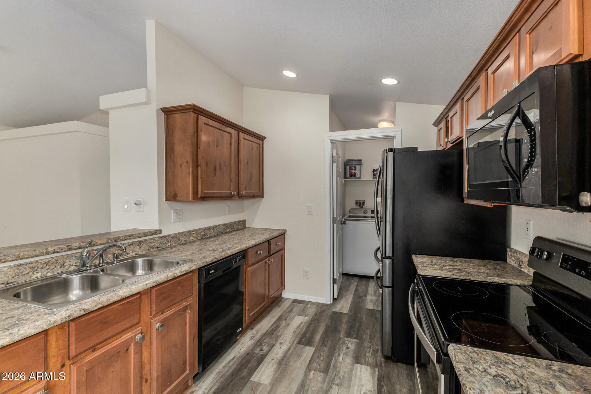 555 West Warner Road, Unit 55 Chandler, AZ 85225 - Photo 15 of 26 a kitchen with stainless steel appliances granite countertop a stove refrigerator and sink