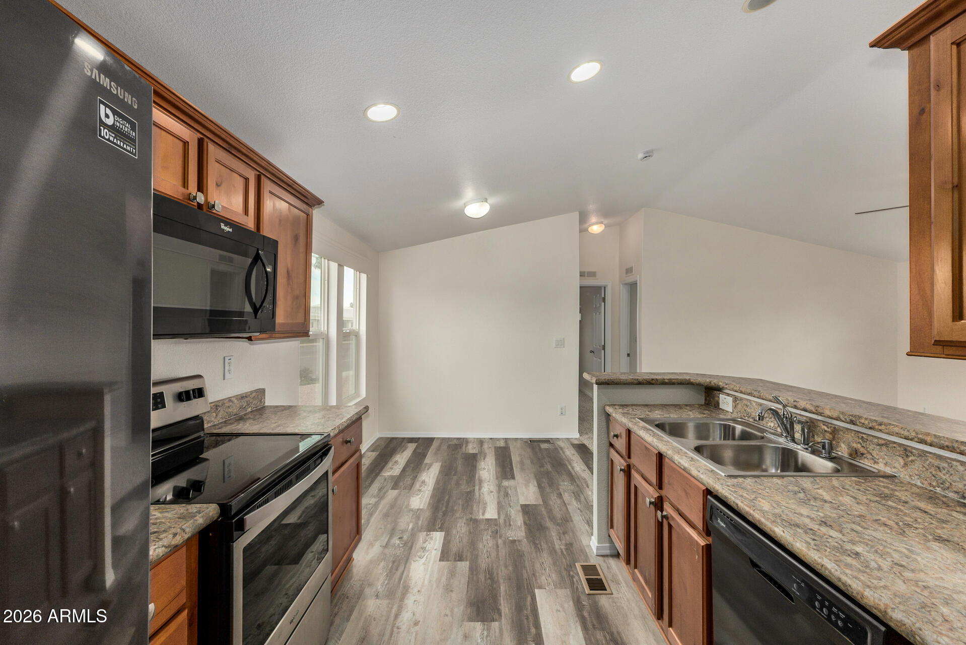 555 West Warner Road, Unit 55 Chandler, AZ 85225 - Photo 16 of 26 a kitchen with a stove and a sink