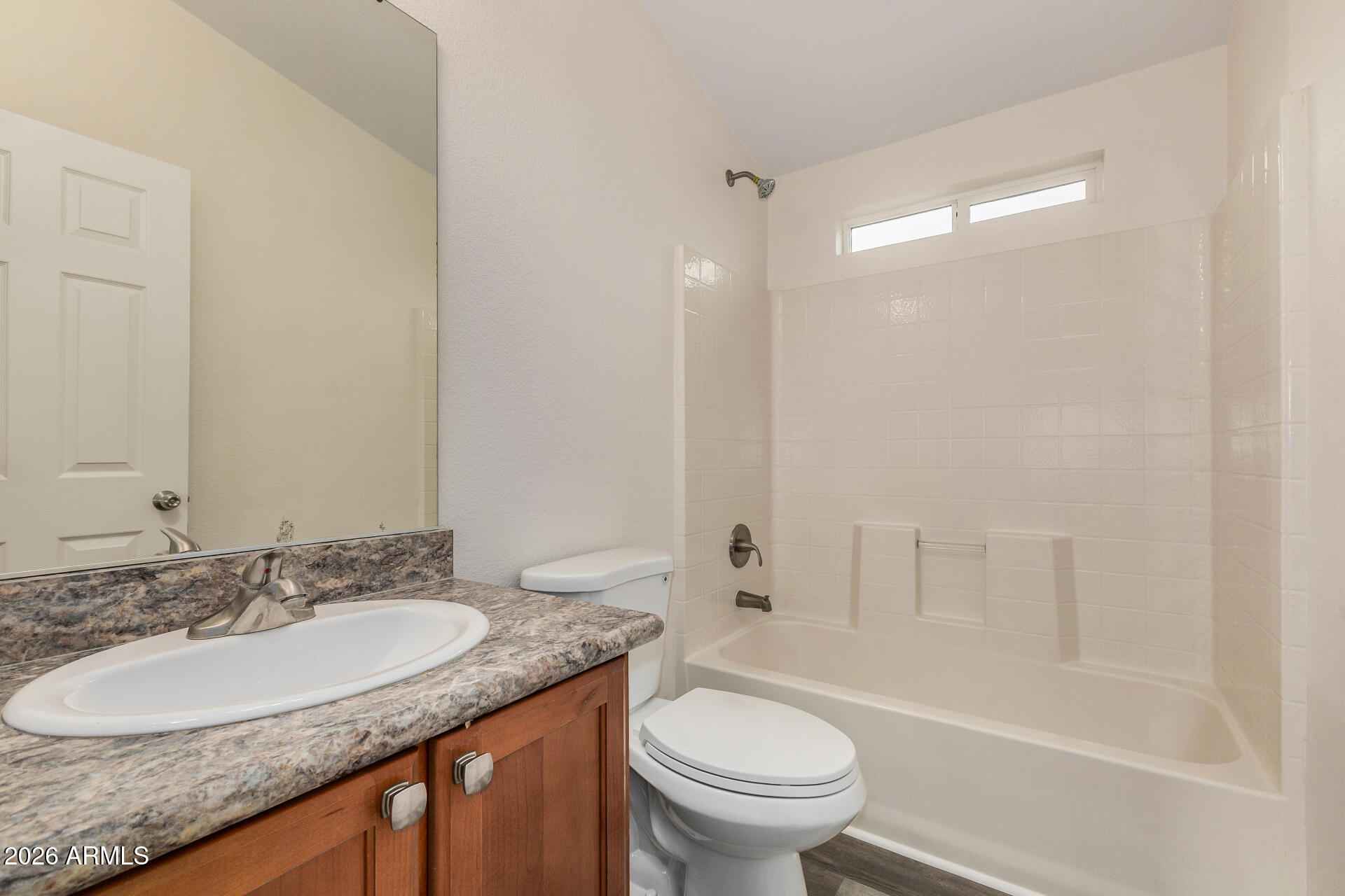 555 West Warner Road, Unit 55 Chandler, AZ 85225 - Photo 25 of 26 a bathroom with a granite countertop sink toilet and shower