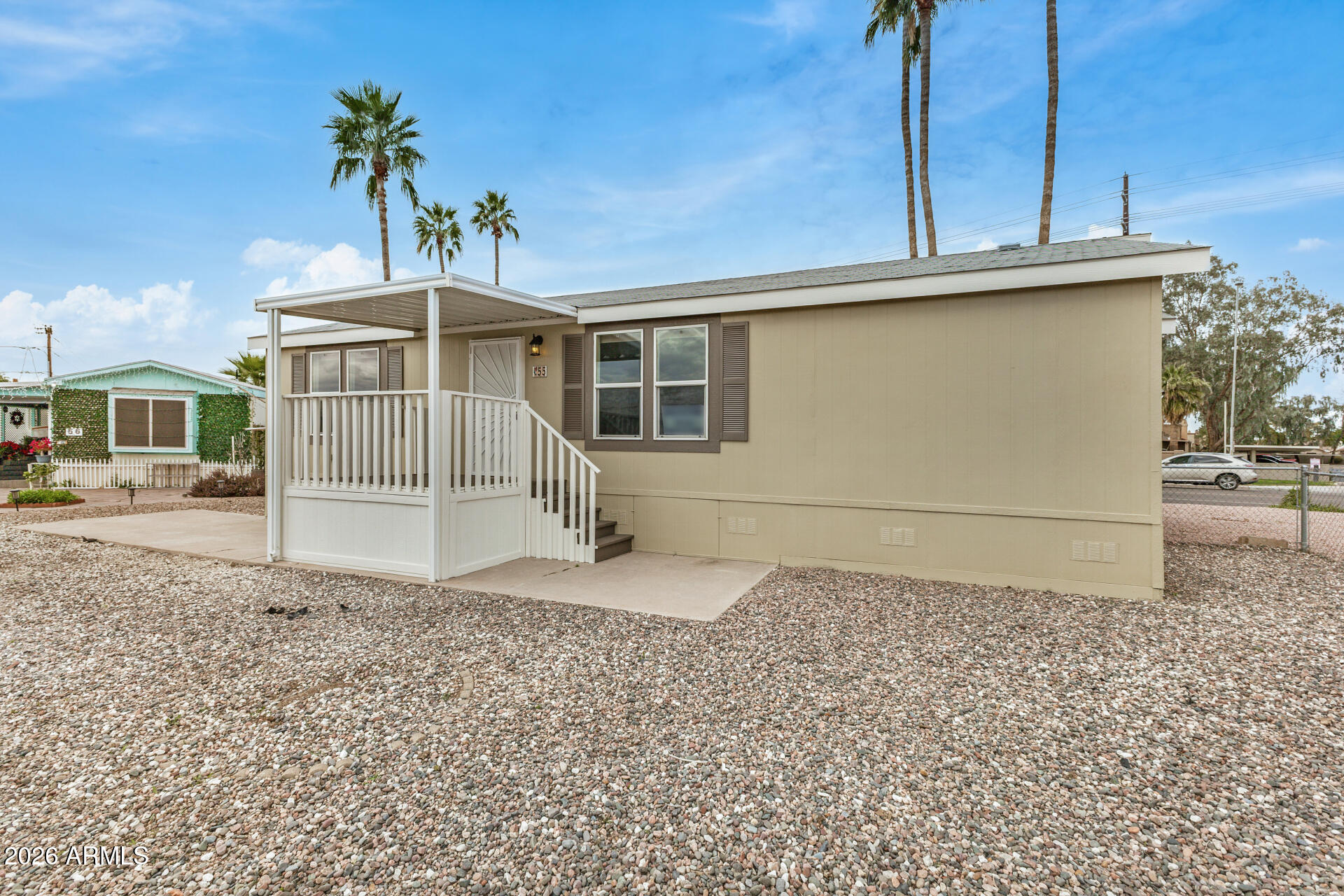 555 West Warner Road, Unit 55 Chandler, AZ 85225 - Photo 4 of 26 a front view of a house with a yard