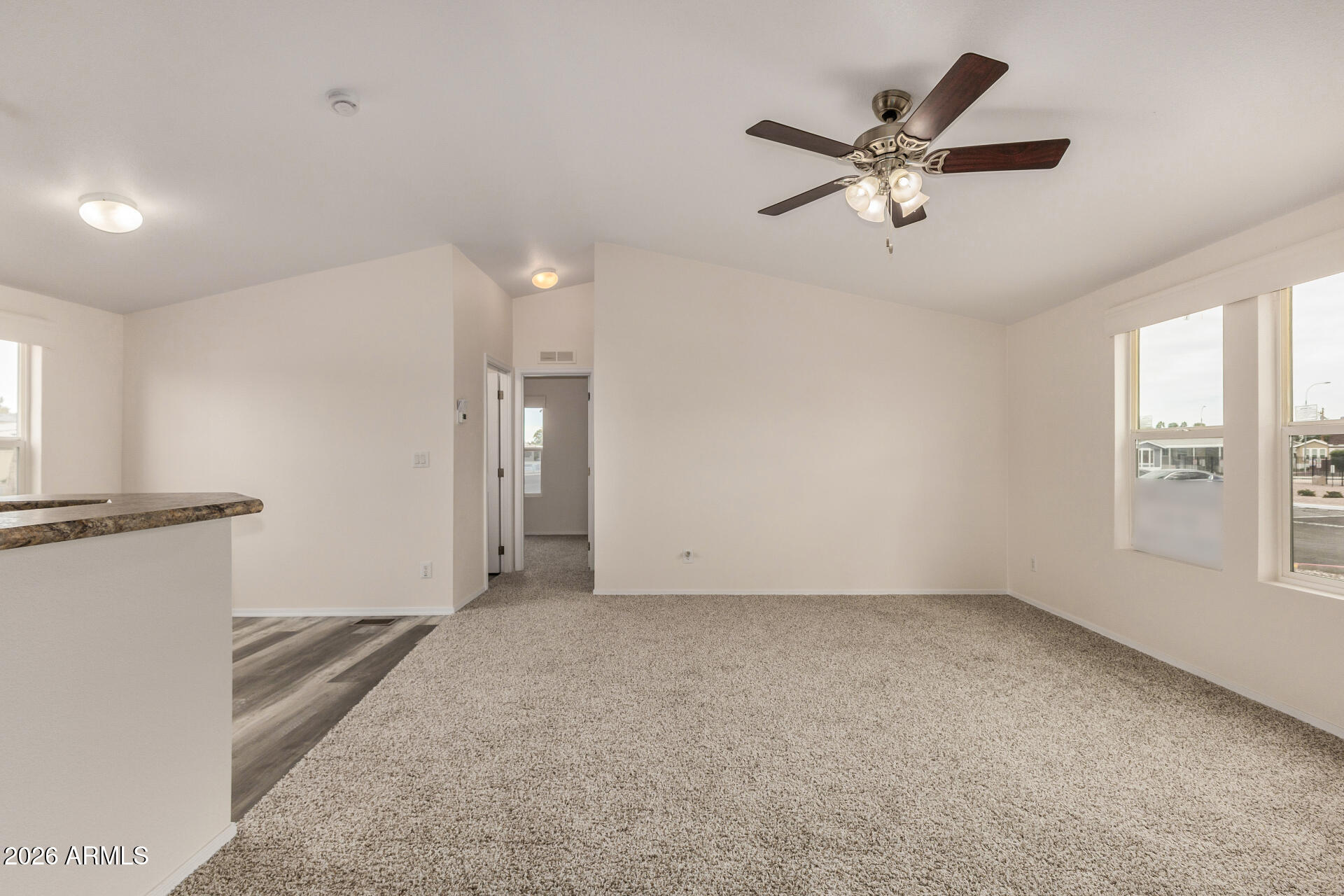 555 West Warner Road, Unit 55 Chandler, AZ 85225 - Photo 8 of 26 a view of an empty room with a window