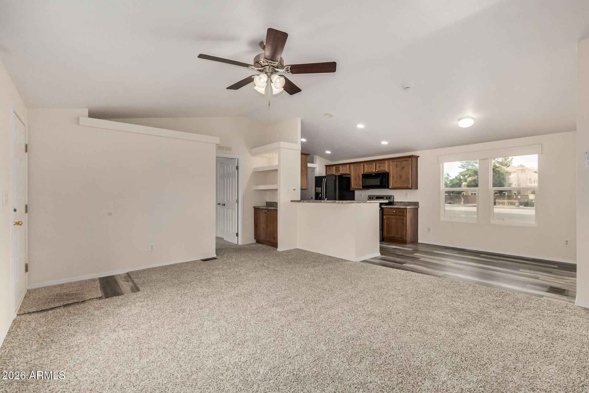 555 West Warner Road, Unit 55 Chandler, AZ 85225 - Photo 9 of 26 a view of a livingroom with wooden floor and white cabinet