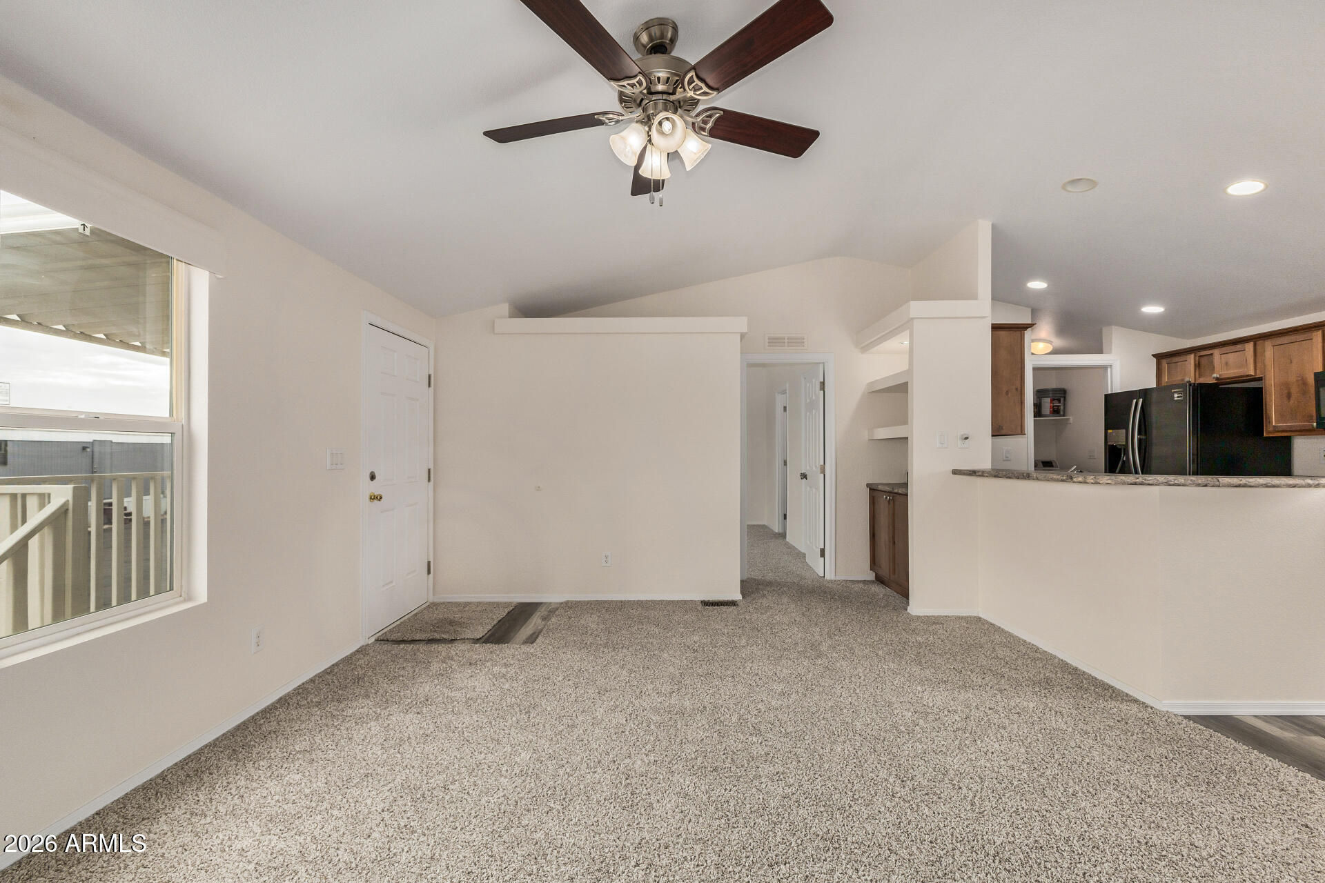 555 West Warner Road, Unit 55 Chandler, AZ 85225 - Photo 10 of 26 a view of a livingroom with a ceiling fan and window