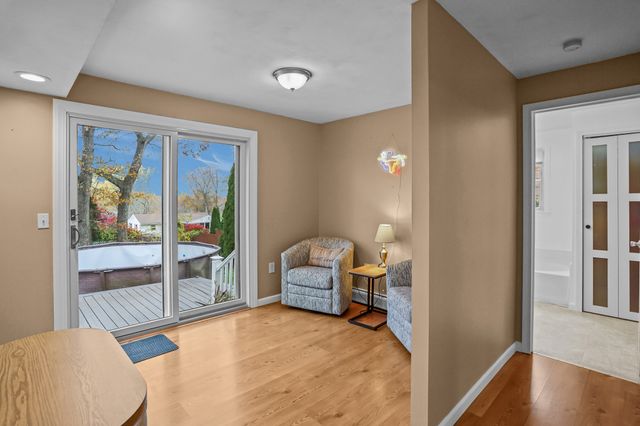 a bedroom with furniture and a window