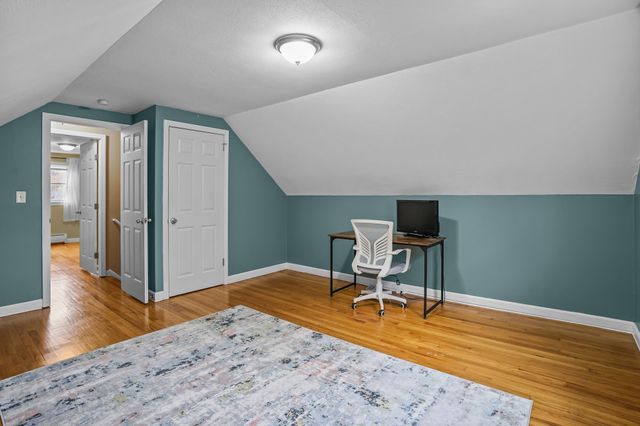 a workspace with furniture and wooden floor