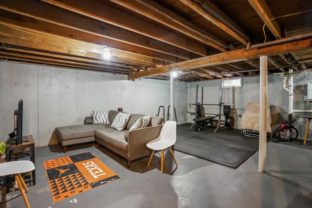 a living room with furniture a couch and a table