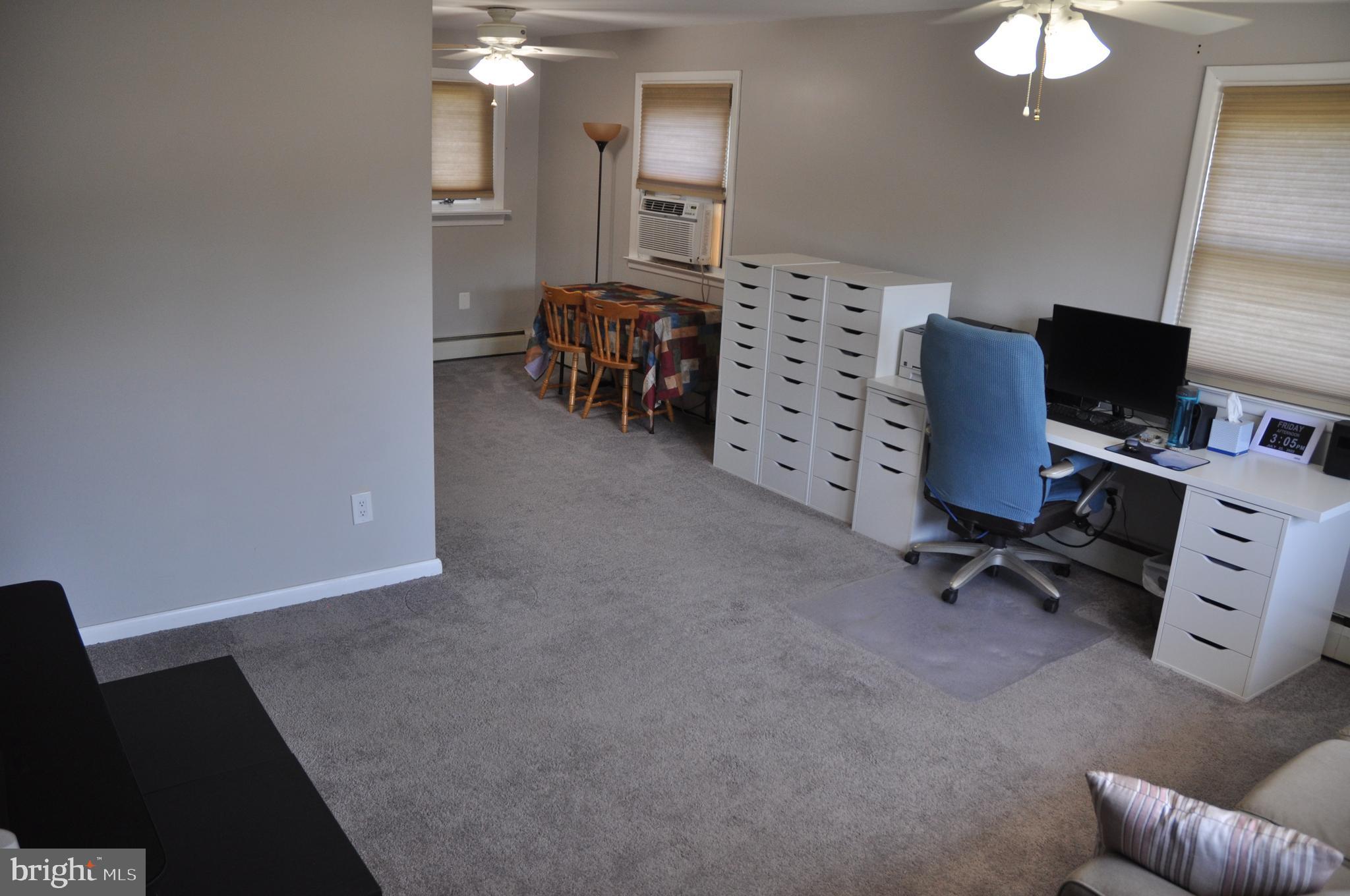 1112 Wynnbrook Road Secane, PA 19018 - Photo 4 of 14 a view of a livingroom with workspace and a window
