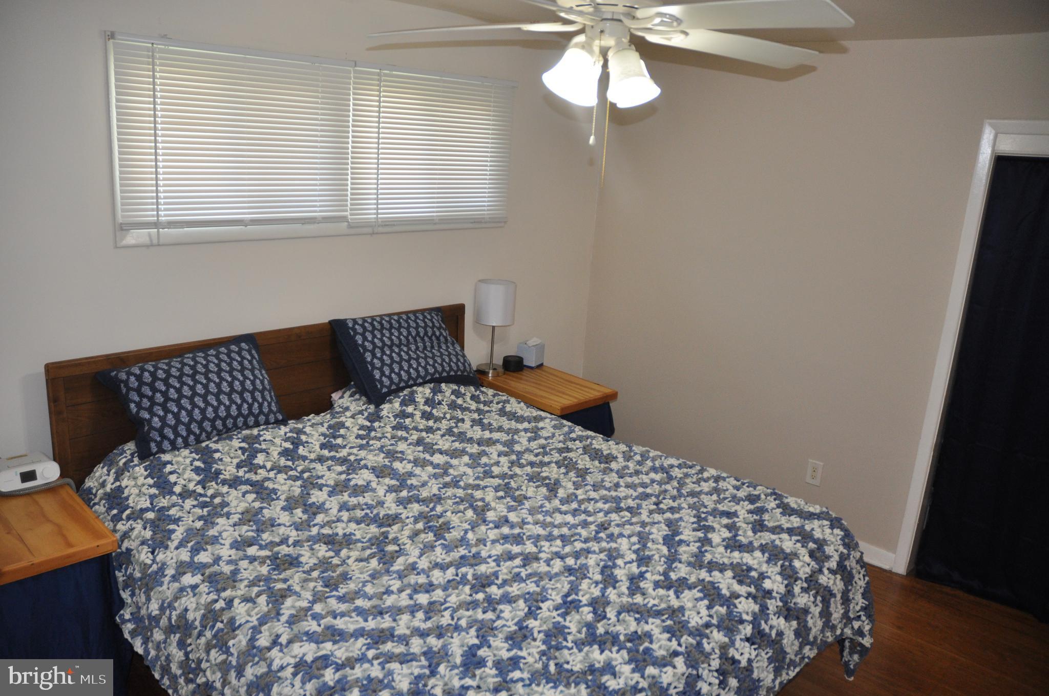 1112 Wynnbrook Road Secane, PA 19018 - Photo 8 of 14 a bedroom with a bed and wooden floor