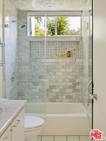 a bathroom with a shower and a bathtub