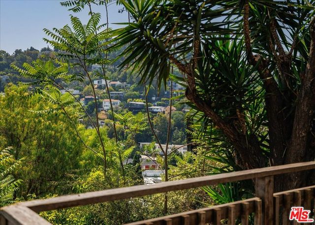 a view of a garden from a balcony