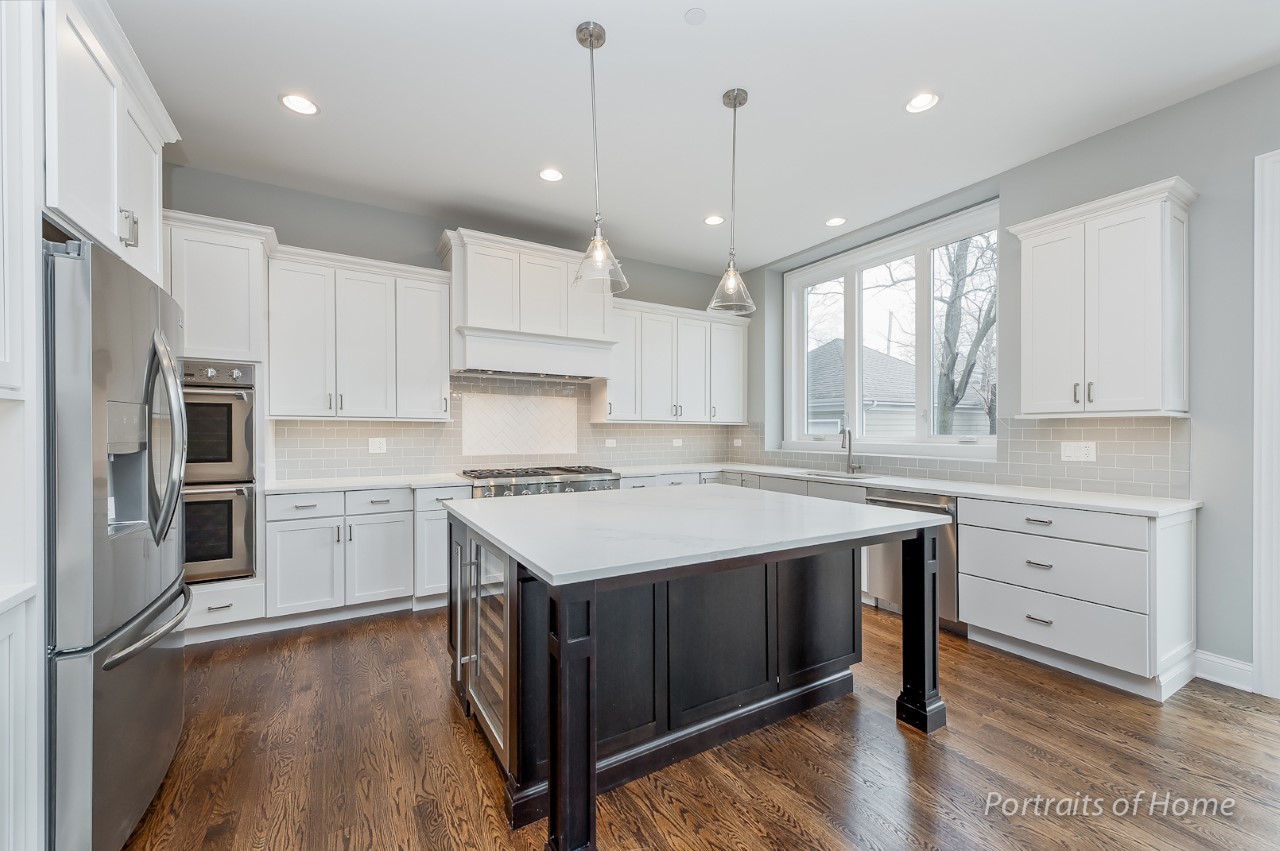 6340 Tennessee Avenue Willowbrook, IL 60527 - Photo 11 of 23 a kitchen with a stove a sink and a refrigerator