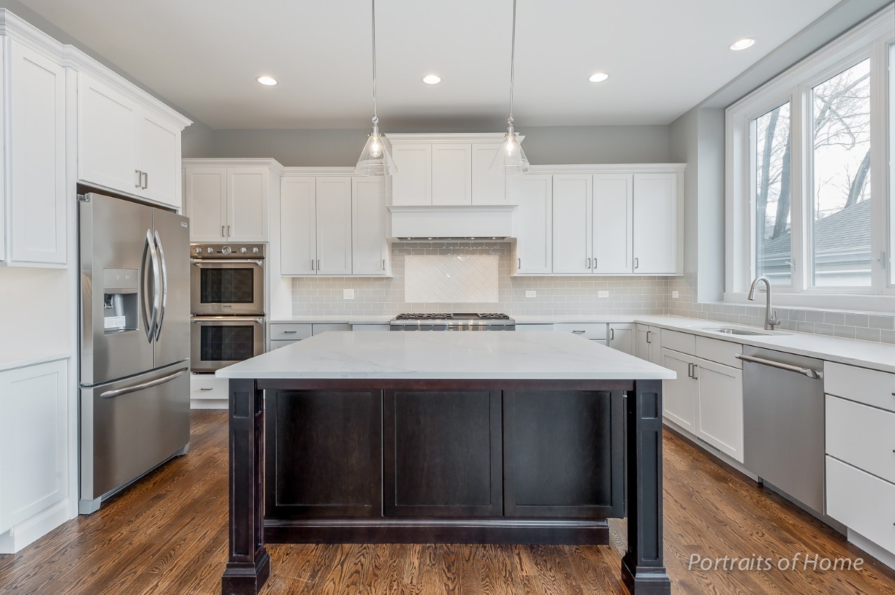 6340 Tennessee Avenue Willowbrook, IL 60527 - Photo 12 of 23 a kitchen with a refrigerator sink and cabinets