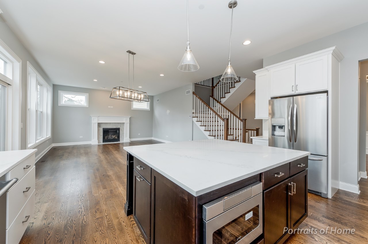 6340 Tennessee Avenue Willowbrook, IL 60527 - Photo 13 of 23 a view of kitchen island with furniture and wooden floor