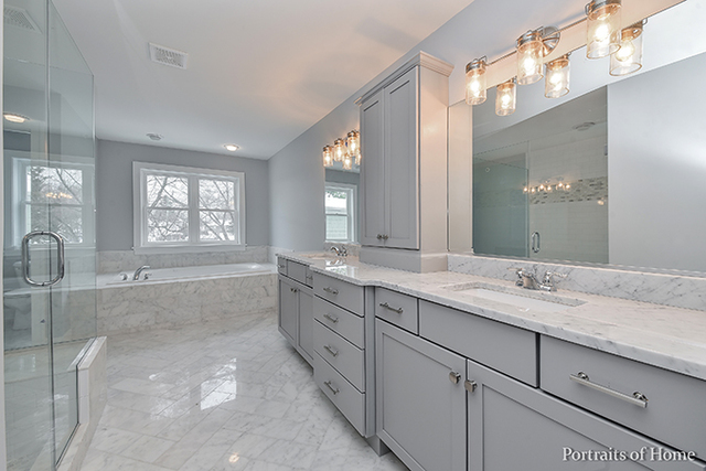 6340 Tennessee Avenue Willowbrook, IL 60527 - Photo 16 of 23 a bathroom with a granite countertop bathtub sink vanity and mirror