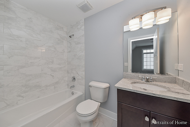 6340 Tennessee Avenue Willowbrook, IL 60527 - Photo 18 of 23 a bathroom with a sink a toilet and shower