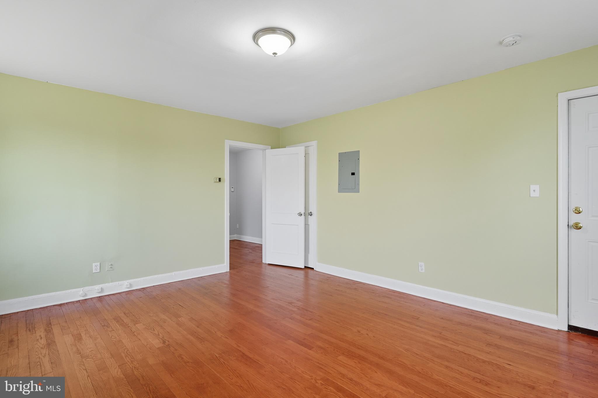 3919 R Street Southeast Washington, DC 20020 - Photo 30 of 41 an empty room with wooden floor and windows