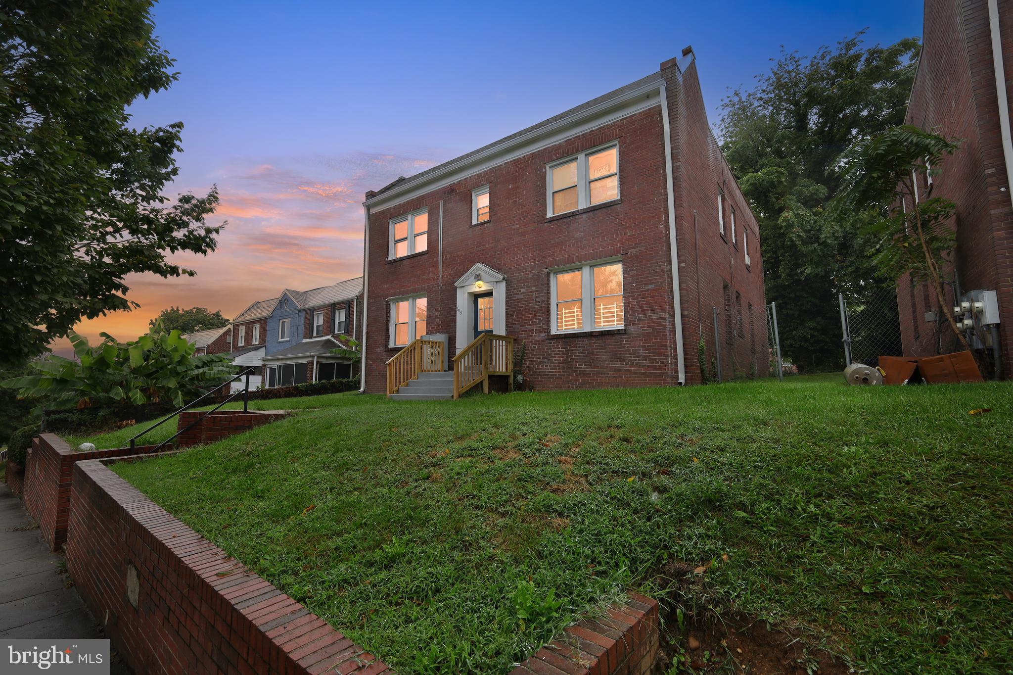 3919 R Street Southeast Washington, DC 20020 - Photo 4 of 41 a front view of a house with garden