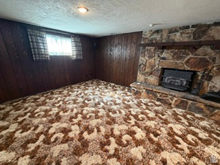588 North 4500 West West Point, UT 84015 - Photo 27 of 61 Stone fireplace with an integrated firebox and a wood mantel