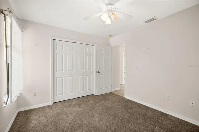a view of a porch with furniture and garden